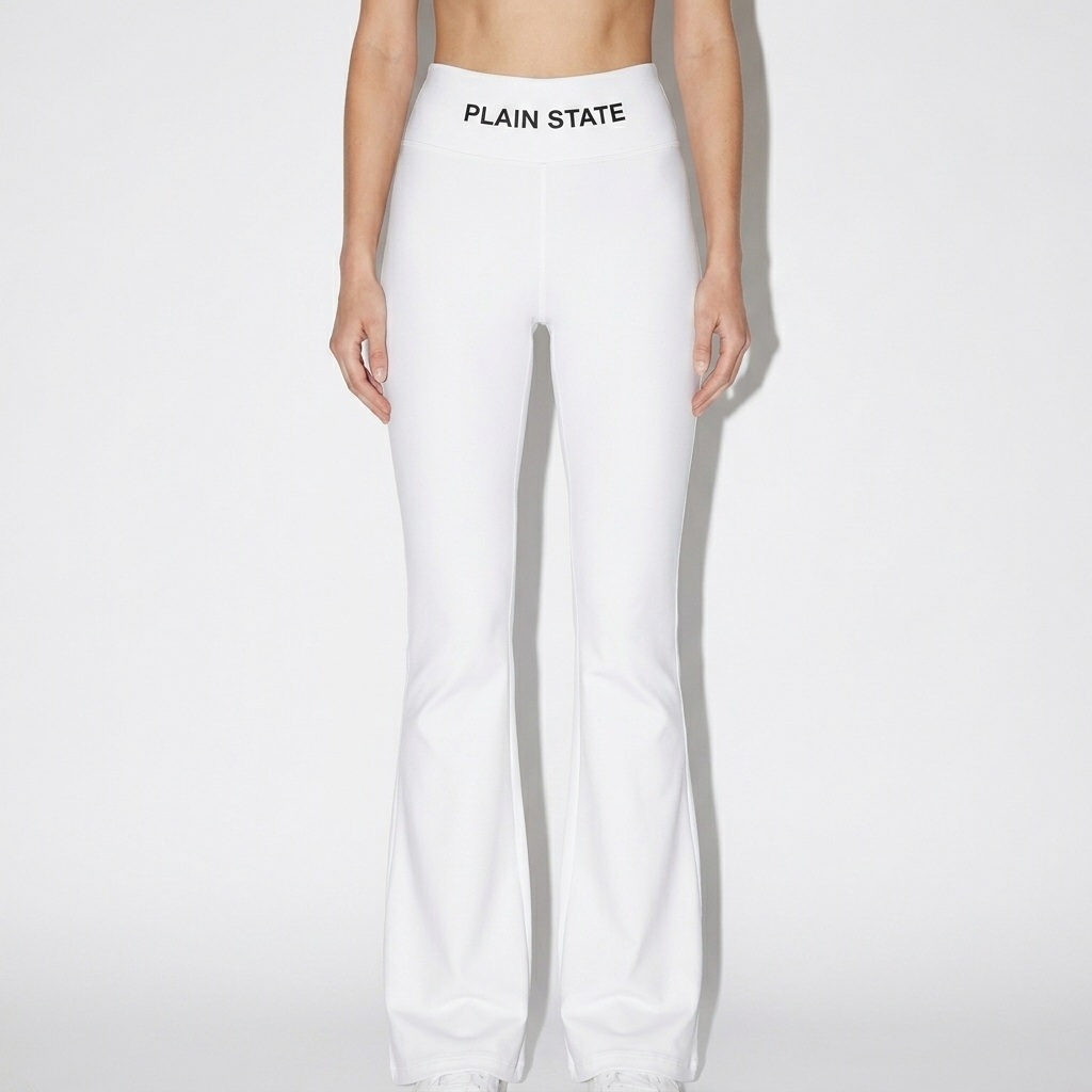 All-Over Print Flare Leggings worn by a lean White European female fashion influencer, editorial avant-garde styling, studio lookbook — custom all-over print flare leggings