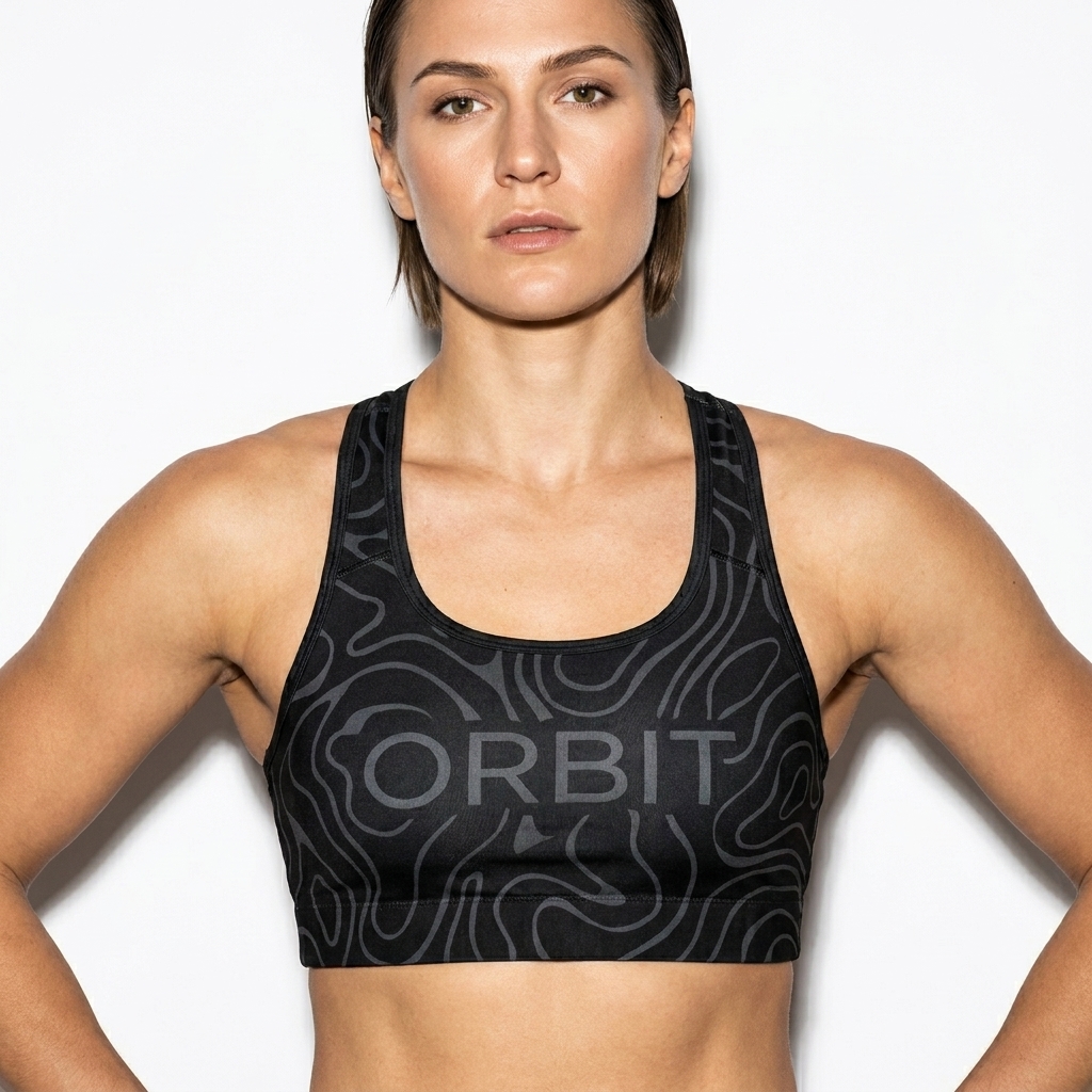 All-Over Print Sports Bra worn by a broad-shouldered Eastern European female fashion influencer, downtown streetwear styling, studio lookbook — custom all-over print sports bra