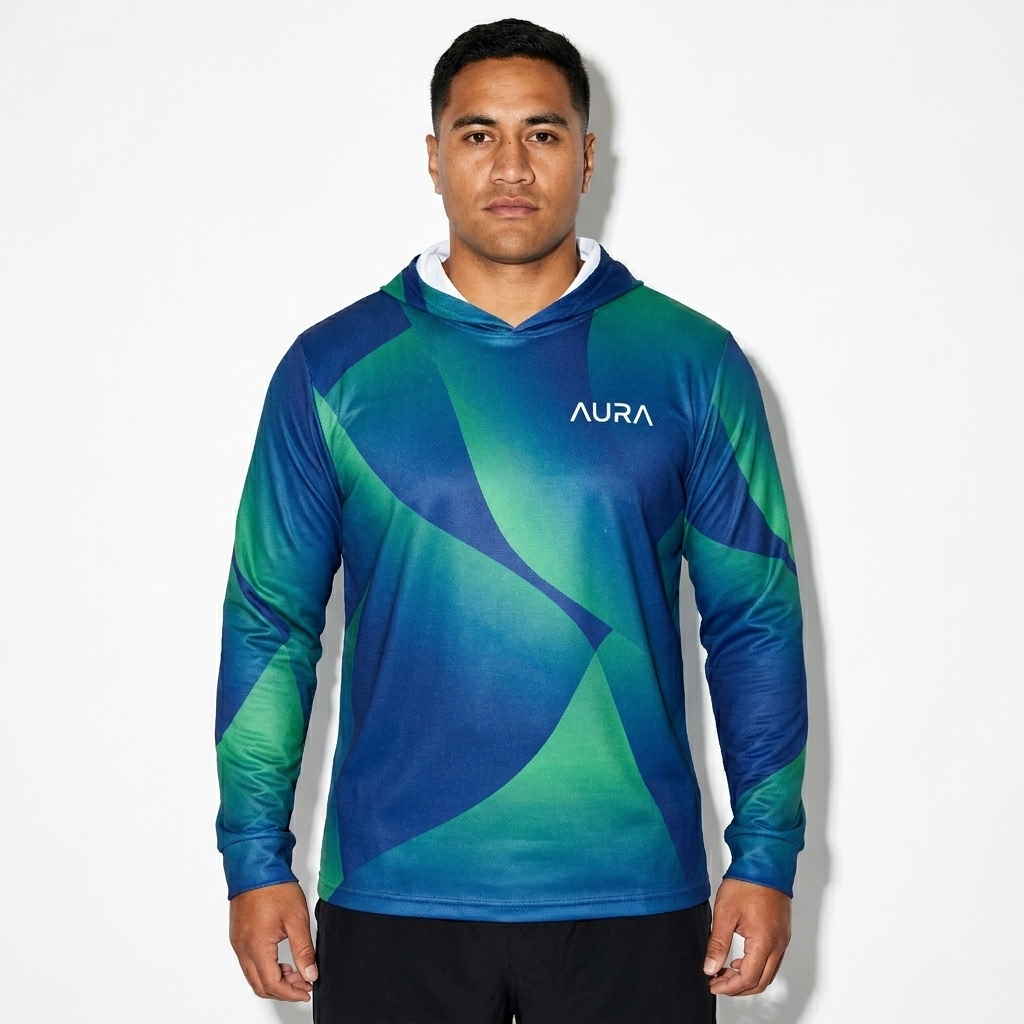 All-Over Print Sports Warmup Hoodie worn by a mid-size Māori male fashion influencer, preppy ivy styling, studio lookbook — custom all-over print sports warmup hoodie