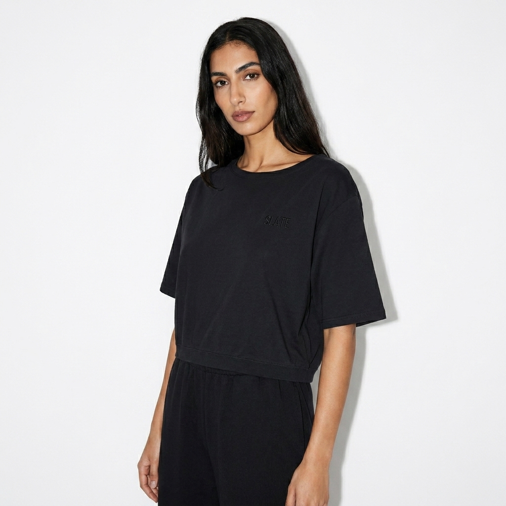 Asymmetric Shoulder Oversized T-Shirt worn by a slim tall Middle Eastern female fashion influencer, editorial avant-garde styling, studio lookbook — custom asymmetric shoulder oversized t-shirt