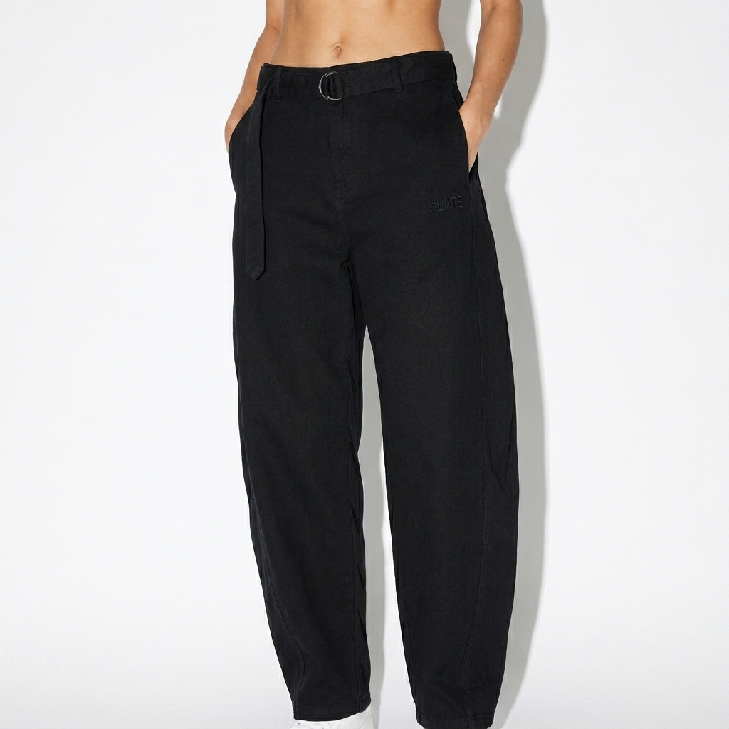 Belted Barrel-Leg Chino Pants worn by a toned White American female fashion influencer, editorial avant-garde styling, studio lookbook — custom belted barrel-leg chino pants