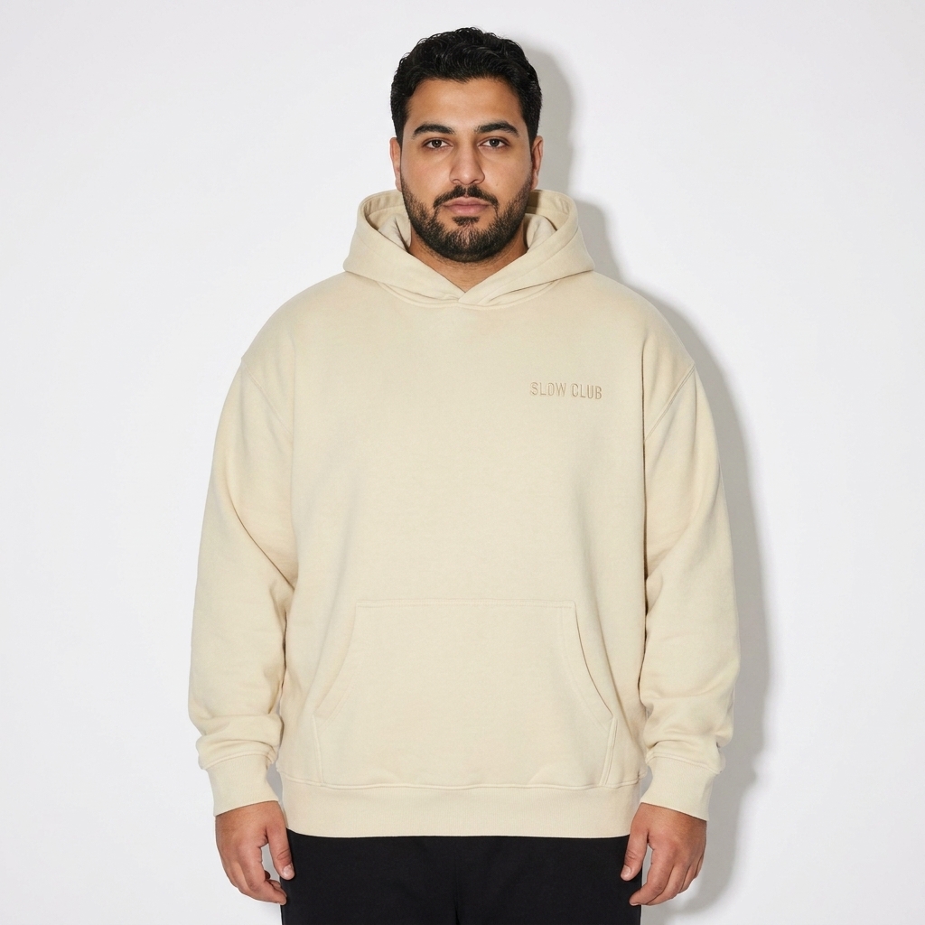 Boxy Fit Pullover Hoodie worn by a curvy Middle Eastern male fashion influencer, downtown streetwear styling, studio lookbook — custom boxy fit pullover hoodie