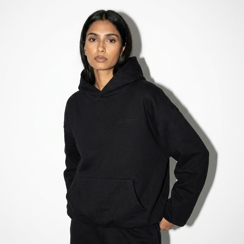 Boxy Gather-Hem Hoodie worn by a lean South Asian female fashion influencer, gorpcore outdoor styling, studio lookbook — custom boxy gather-hem hoodie