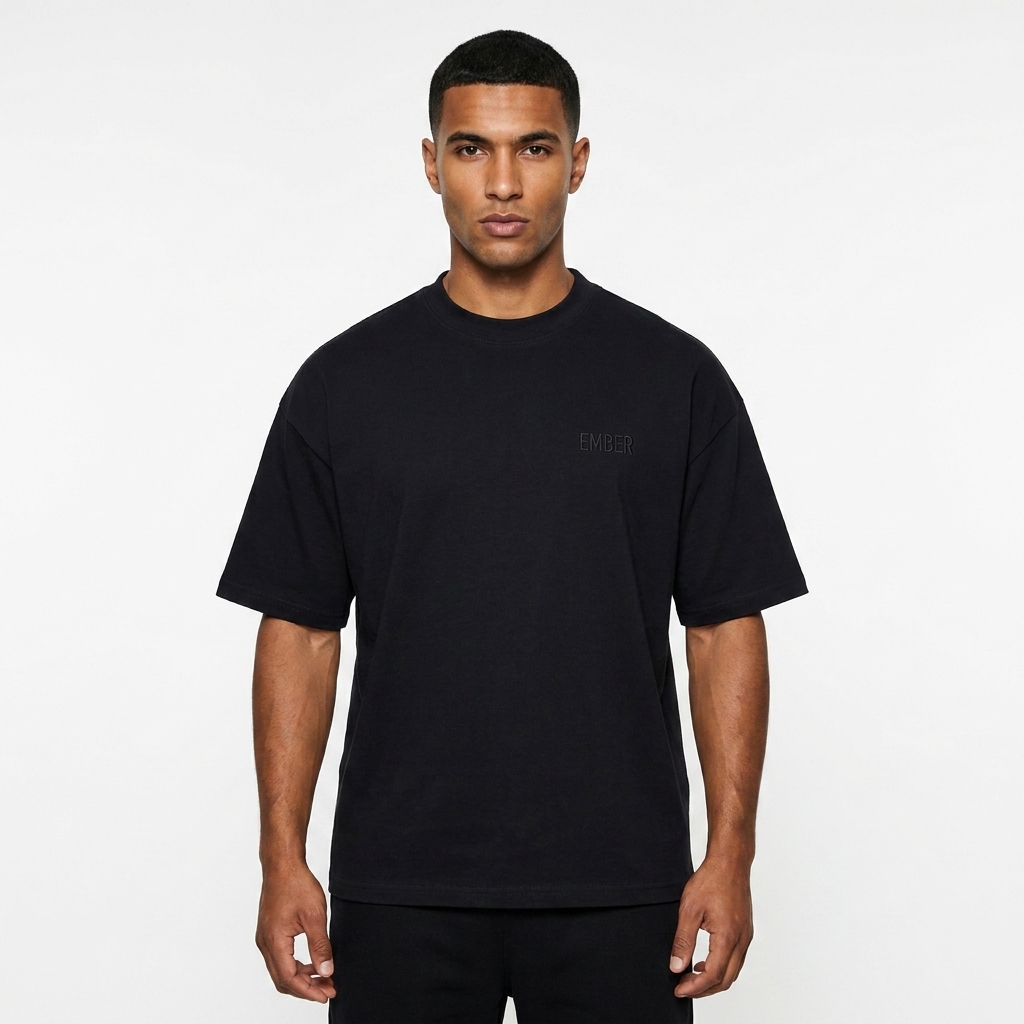 Boxy Performance T-Shirt worn by a toned North African male fashion influencer, downtown streetwear styling, studio lookbook — custom boxy performance t-shirt