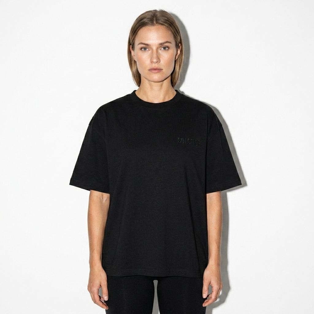 Classic Loose Boxy Tee worn by a toned Scandinavian female fashion influencer, minimalist luxury styling, studio lookbook — custom classic loose boxy tee