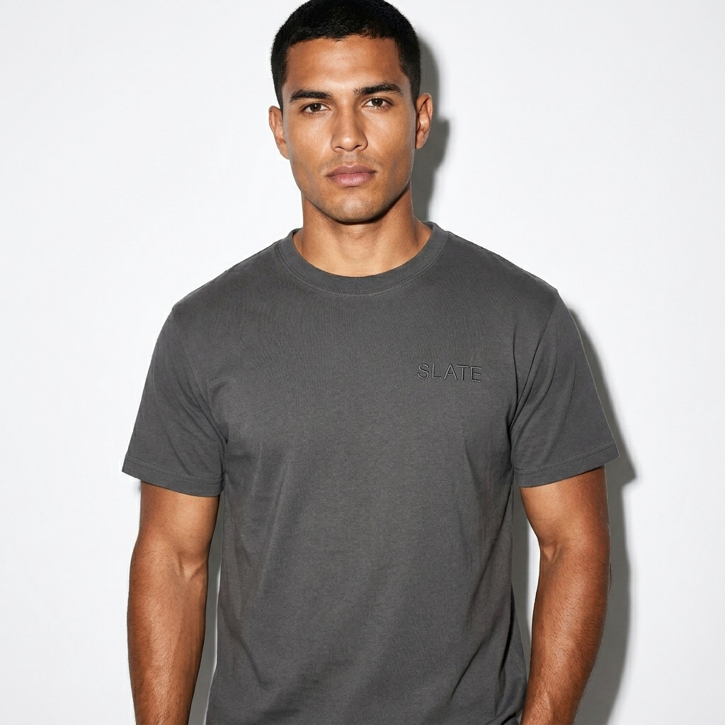 Classic Unisex T-Shirt worn by a mid-size Latino male fashion influencer, clean-girl minimal styling, studio lookbook — custom classic unisex t-shirt