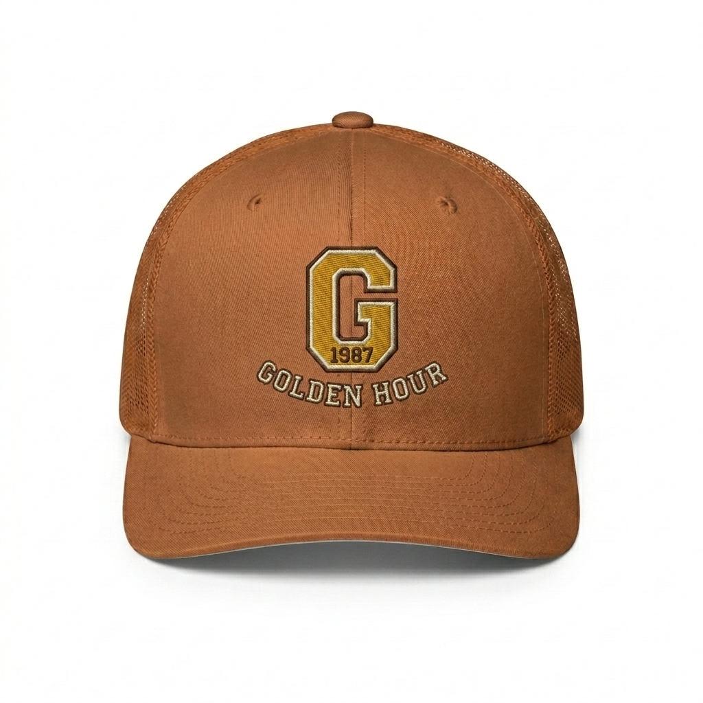 Custom Closed-Back Trucker Cap design direction 3: Retro Collegiate Emblem featuring the GOLDEN HOUR wordmark