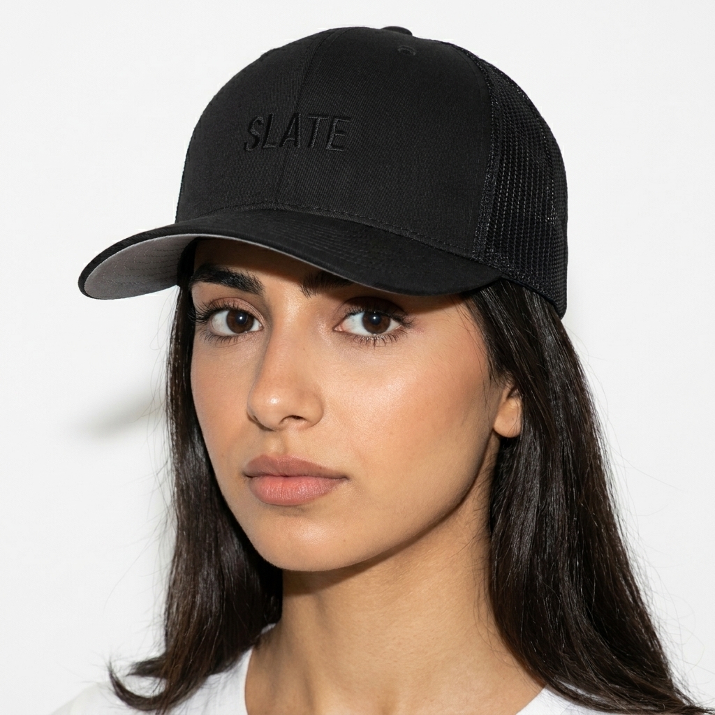 Closed-Back Trucker Cap worn by a petite Arab female fashion influencer, sporty athleisure styling, studio lookbook — custom closed-back trucker cap
