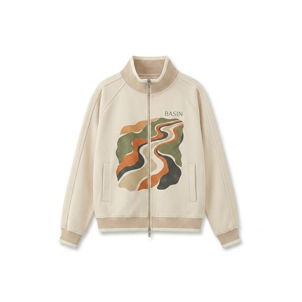 Custom Color Block Raglan Track Jacket design direction 2: Abstract Organic Graphic featuring the BASIN wordmark