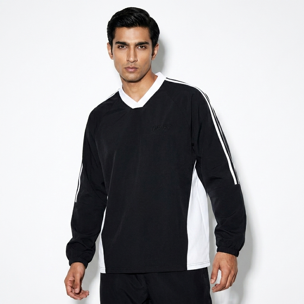 Color-Block V-Neck Long-Sleeve T-Shirt worn by a lean Pakistani male fashion influencer, minimalist luxury styling, studio lookbook — custom color-block v-neck long-sleeve t-shirt