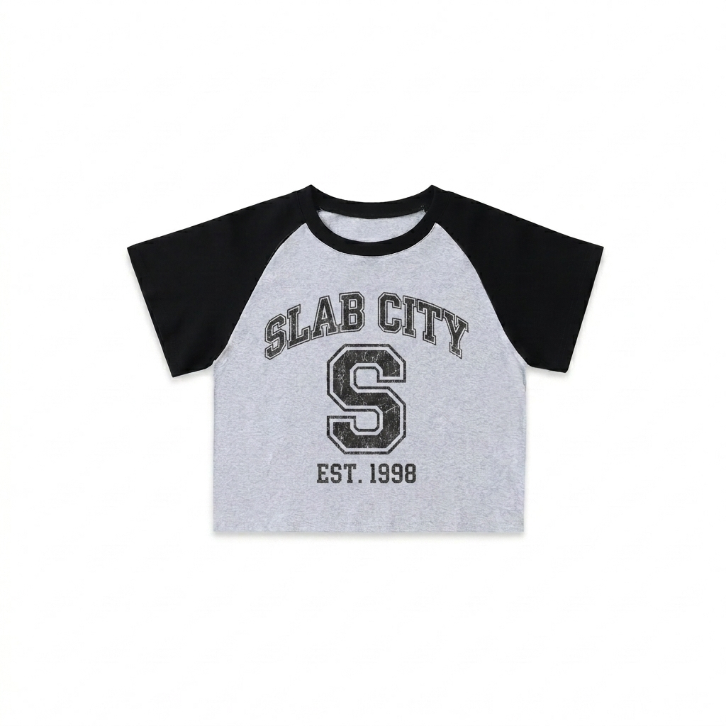 Custom Color-Blocked Raglan Crop Top design direction 3: Retro Collegiate Emblem featuring the SLAB CITY wordmark