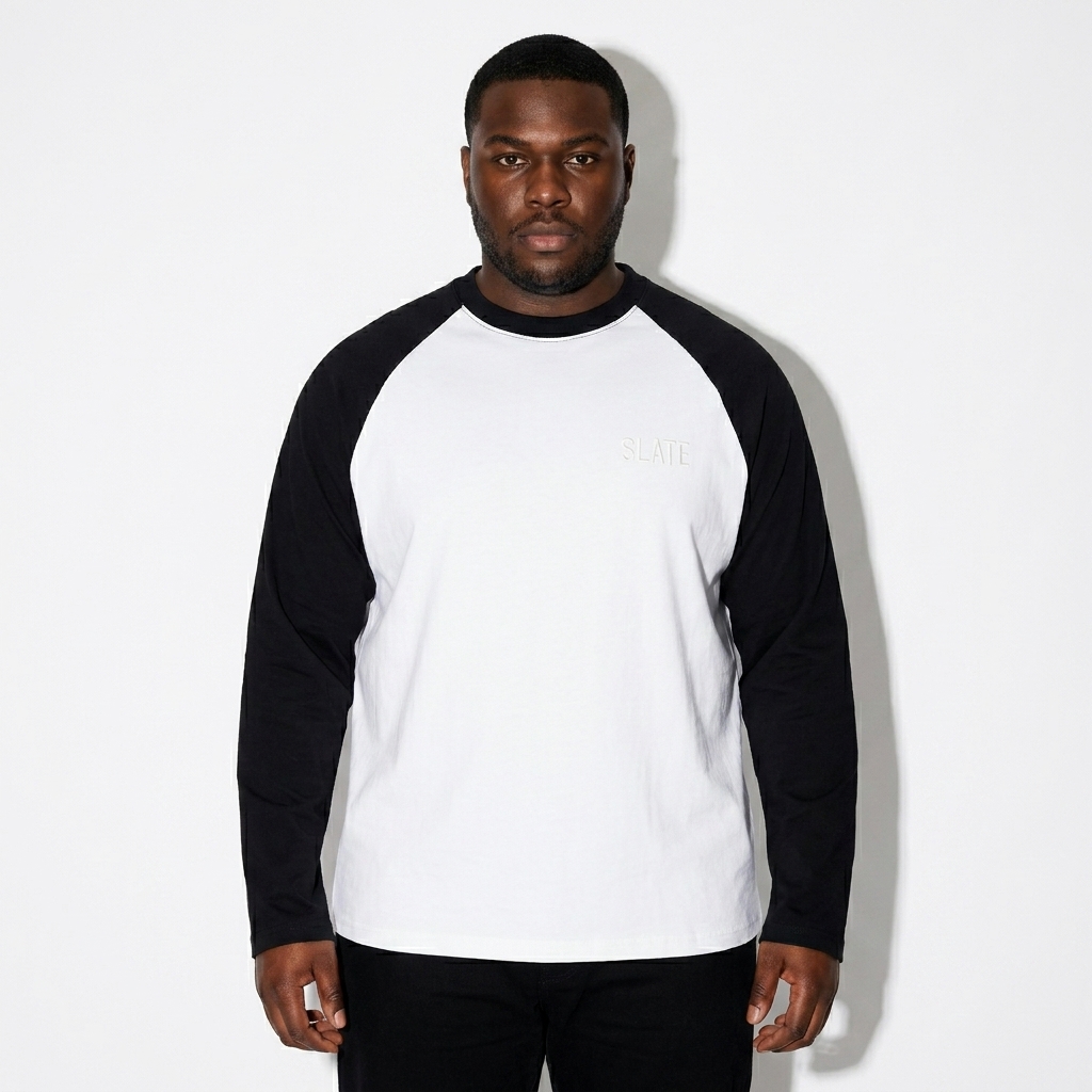 Color-Blocked Raglan Long-Sleeve T-Shirt worn by a curvy Black male fashion influencer, minimalist luxury styling, studio lookbook — custom color-blocked raglan long-sleeve t-shirt
