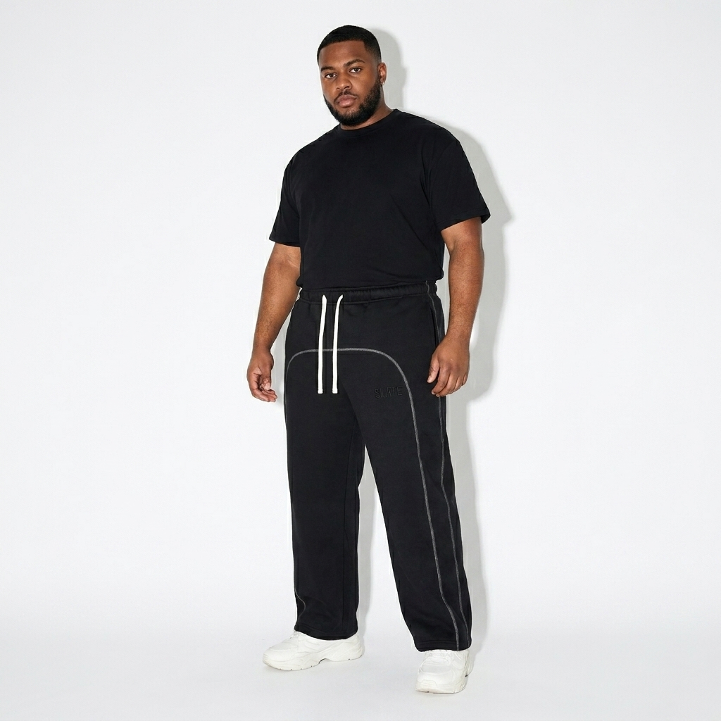 Contrast-Stitch Fleece Sweatpants worn by a curvy British male fashion influencer, gorpcore outdoor styling, studio lookbook — custom contrast-stitch fleece sweatpants