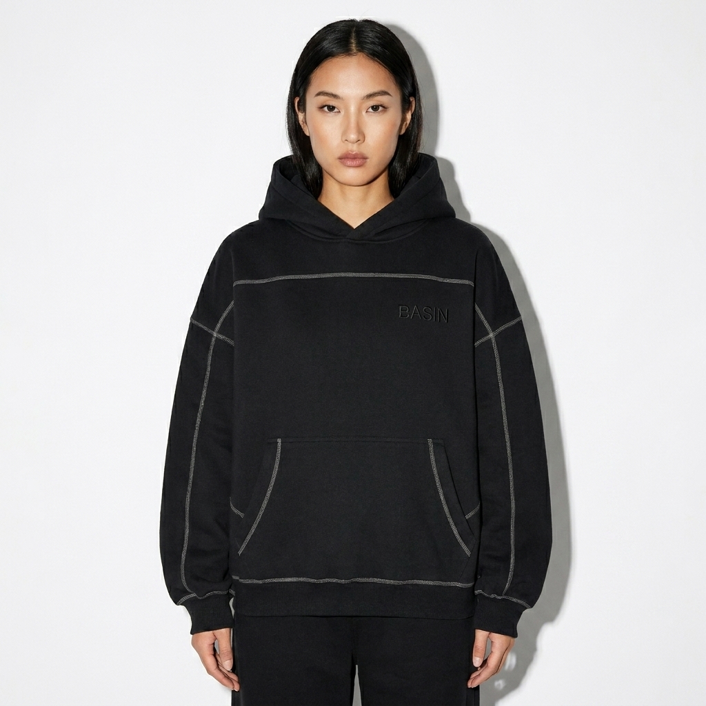 Contrast-Stitched Boxy Fleece Hoodie worn by a toned East Asian female fashion influencer, editorial avant-garde styling, studio lookbook — custom contrast-stitched boxy fleece hoodie