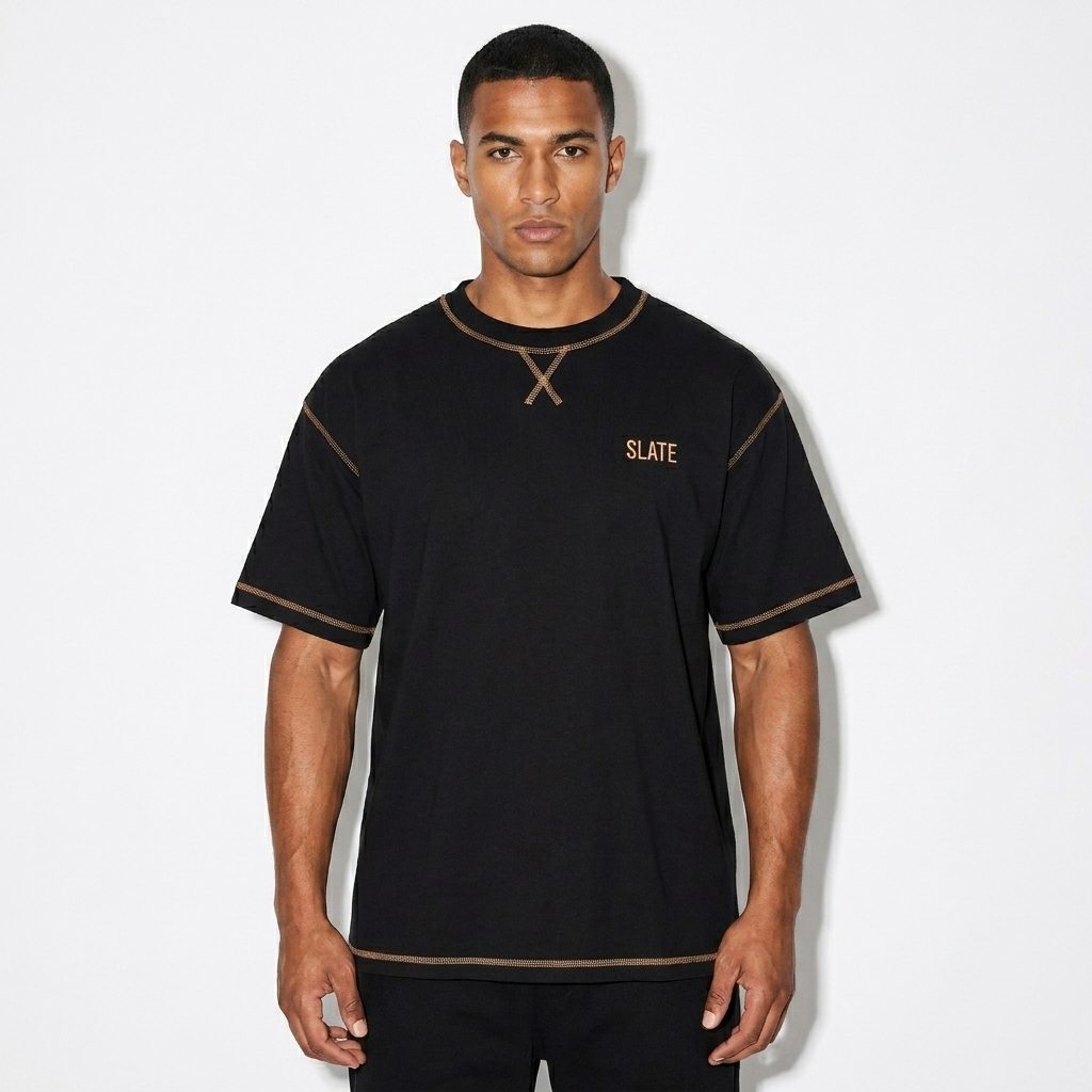 Contrast-Stitched T-Shirt worn by a athletic muscular North African male fashion influencer, sporty athleisure styling, studio lookbook — custom contrast-stitched t-shirt