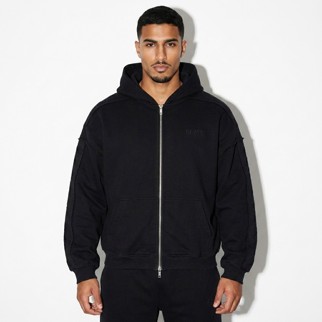 Contrast Tape Zip Hoodie worn by a toned Arab male fashion influencer, downtown streetwear styling, studio lookbook — custom contrast tape zip hoodie
