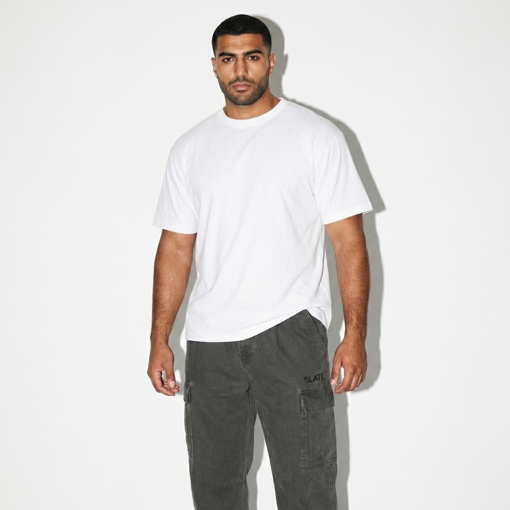 Cotton Elastic-Waist Cargo Pants worn by a broad-shouldered Middle Eastern male fashion influencer, editorial avant-garde styling, studio lookbook — custom cotton elastic-waist cargo pants