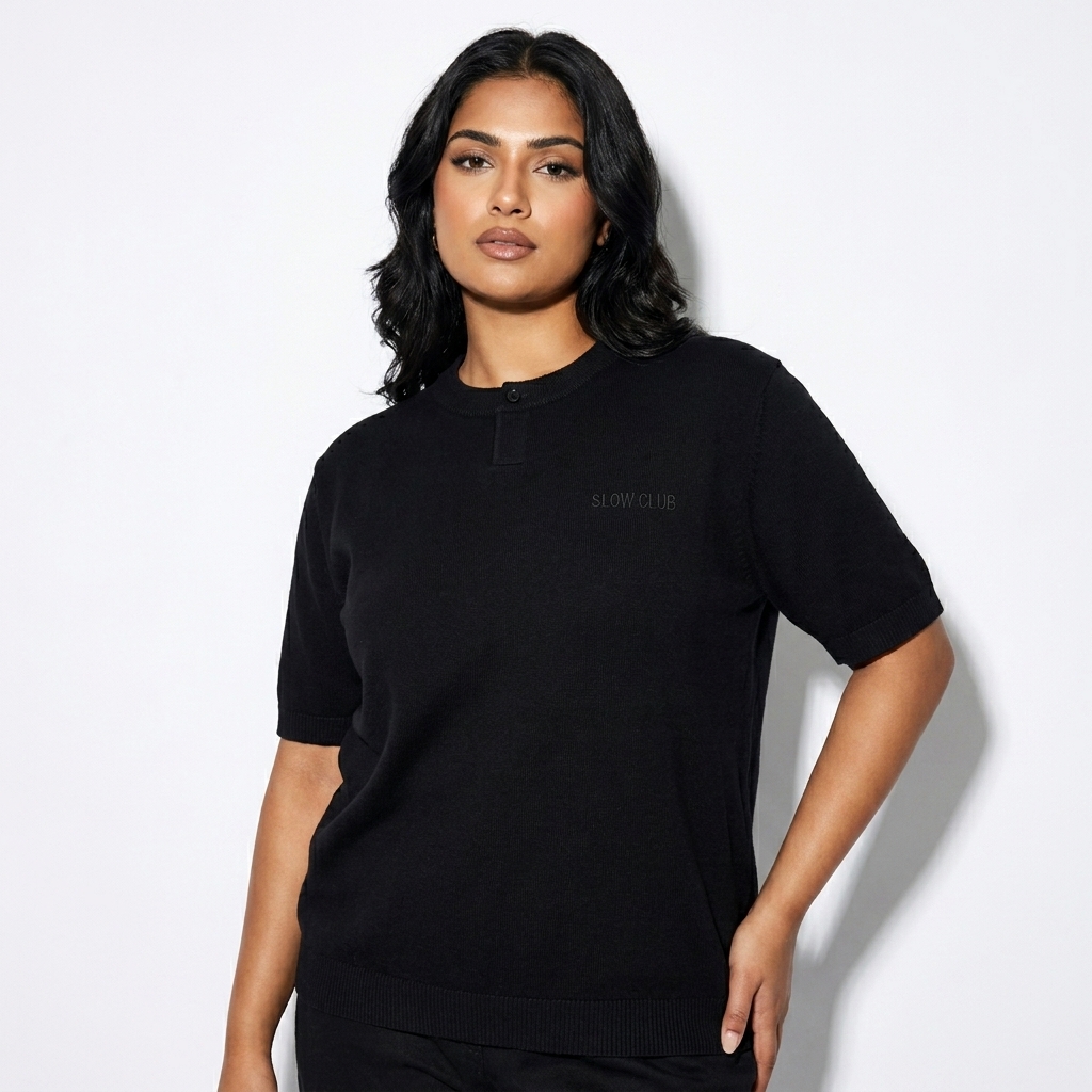 Cotton Knit Henley T-Shirt worn by a mid-size South Asian female fashion influencer, preppy ivy styling, studio lookbook — custom cotton knit henley t-shirt