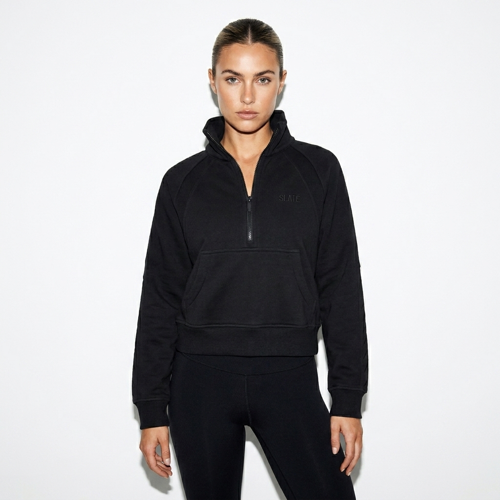 Cropped Half-Zip Sweatshirt worn by a toned Australian female fashion influencer, gorpcore outdoor styling, studio lookbook — custom cropped half-zip sweatshirt