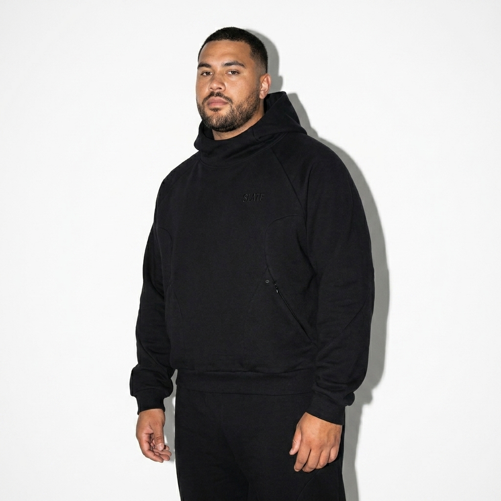 Curved Panel Raglan Hoodie worn by a curvy Australian male fashion influencer, preppy ivy styling, studio lookbook — custom curved panel raglan hoodie