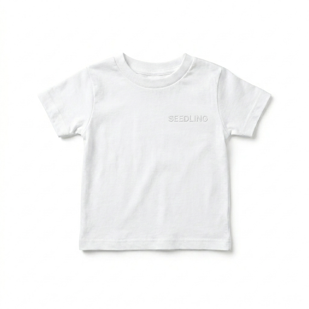 Custom Baby Staple Tee design direction 1: Tonal Minimalist Wordmark featuring the SEEDLING wordmark