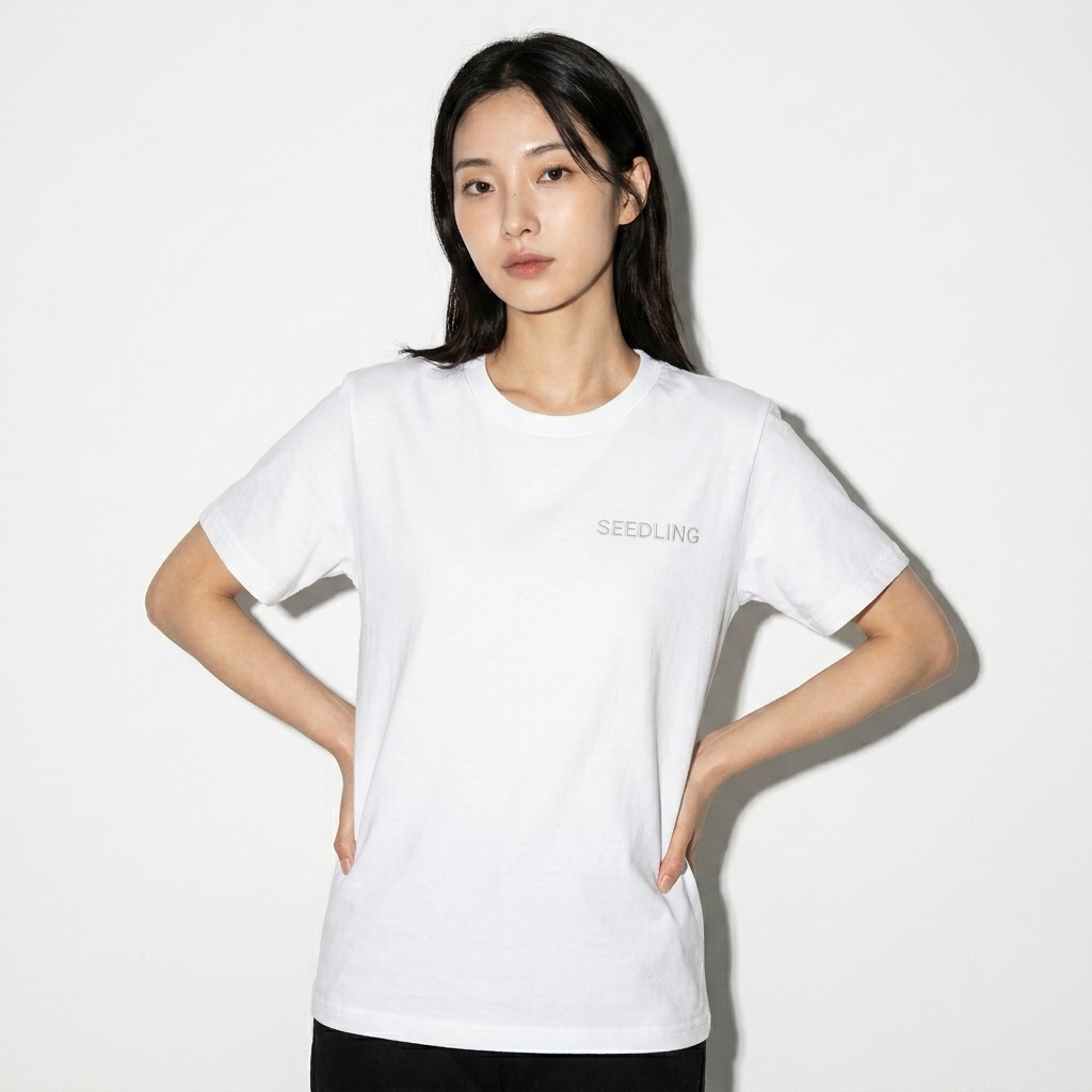 Baby Staple Tee worn by a slim tall Korean female fashion influencer, editorial avant-garde styling, studio lookbook — custom baby staple tee