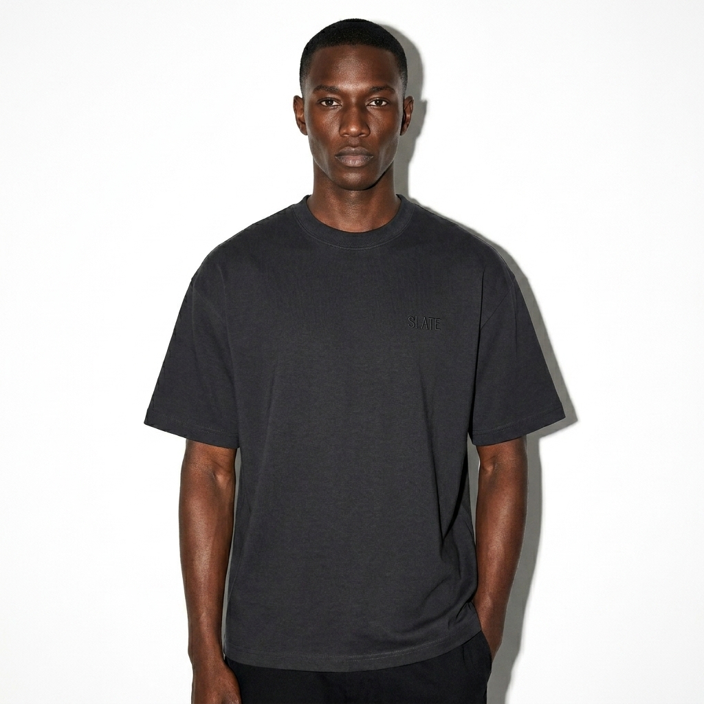 Custom Boxy Fit T-Shirt worn by a lean East African male fashion influencer, y2k revival styling, studio lookbook — custom custom boxy fit t-shirt