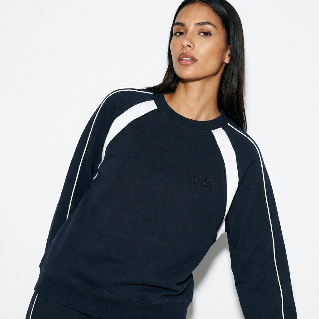 Color Block Crewneck Sweatshirt worn by a lean Hispanic female fashion influencer, editorial avant-garde styling, studio lookbook — custom color block crewneck sweatshirt