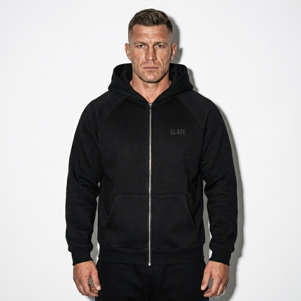 Essential Zip-Up Hoodie worn by a athletic muscular Eastern European male fashion influencer, preppy ivy styling, studio lookbook — custom essential zip-up hoodie