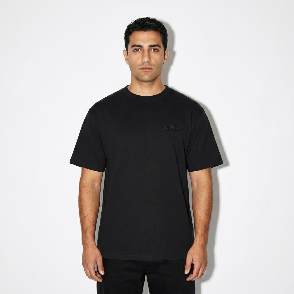 Custom Heritage T-Shirt worn by a mid-size Mediterranean male fashion influencer, downtown streetwear styling, studio lookbook — custom custom heritage t-shirt