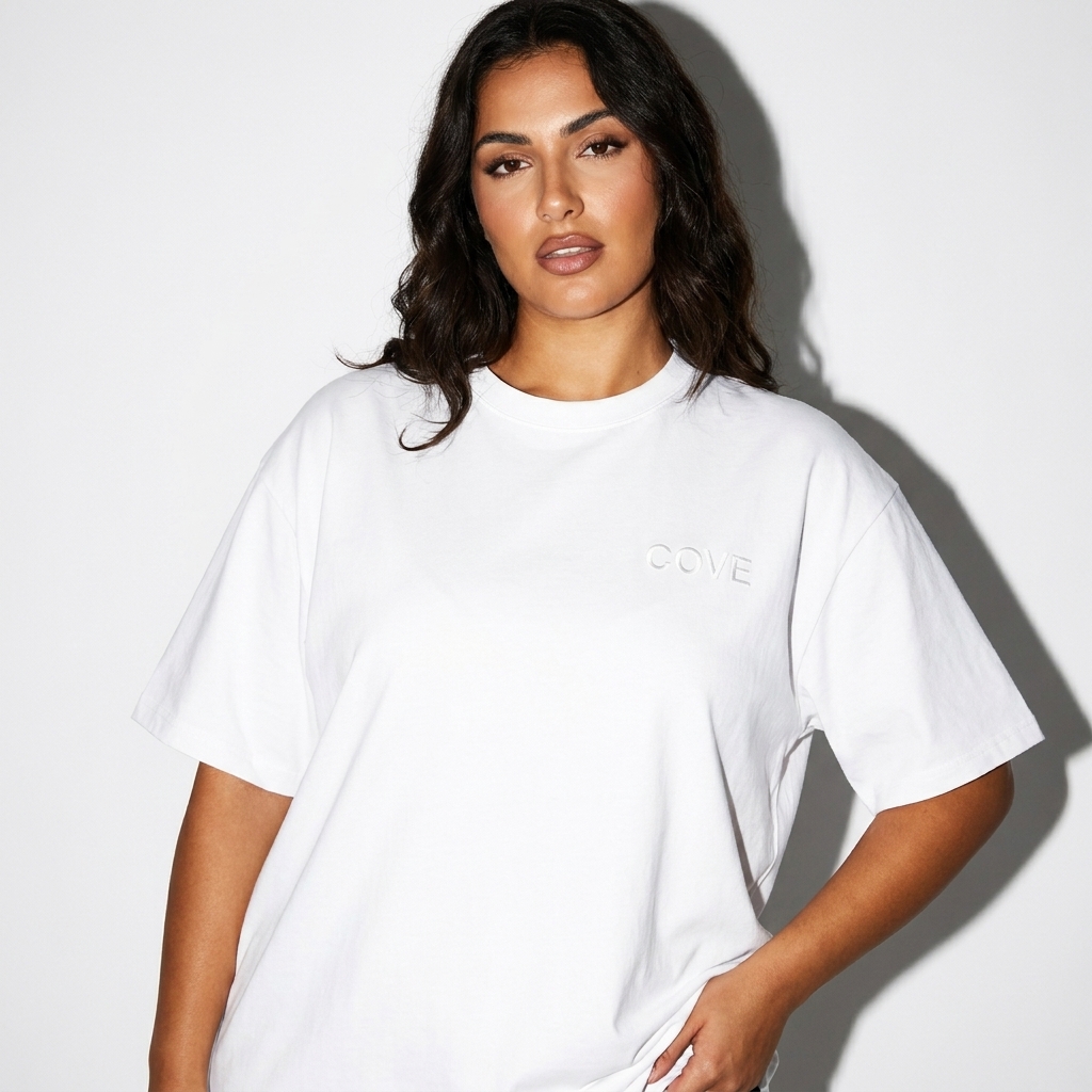 Pure Cotton T-Shirt worn by a curvy Mediterranean female fashion influencer, minimalist luxury styling, studio lookbook — custom pure cotton t-shirt