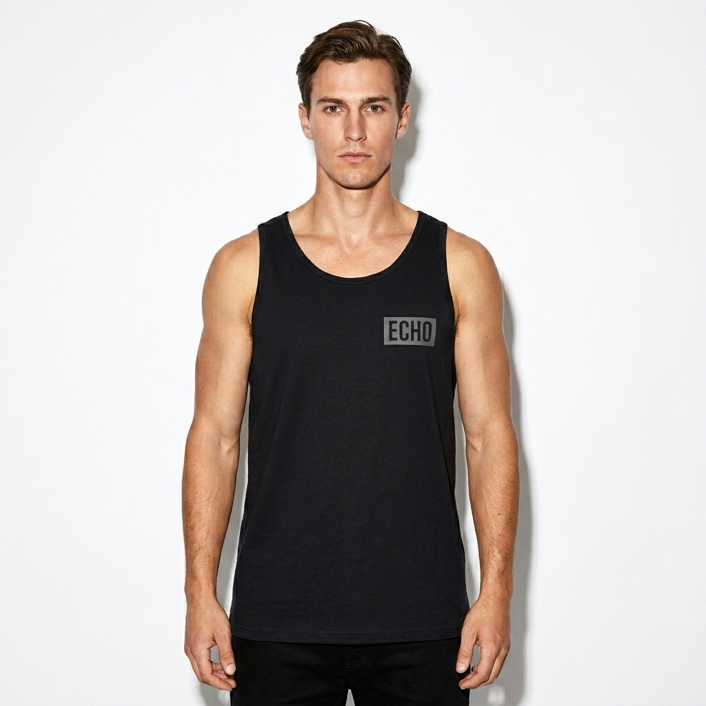 Staple Tank Top worn by a lean Australian male fashion influencer, preppy ivy styling, studio lookbook — custom staple tank top