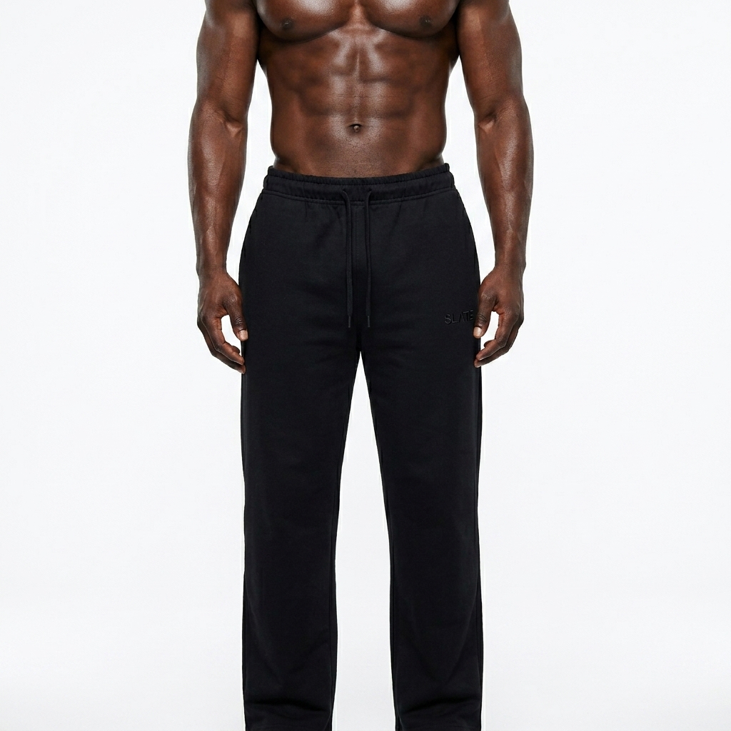 Straight-Leg Sweatpants worn by a athletic muscular West African male fashion influencer, editorial avant-garde styling, studio lookbook — custom straight-leg sweatpants