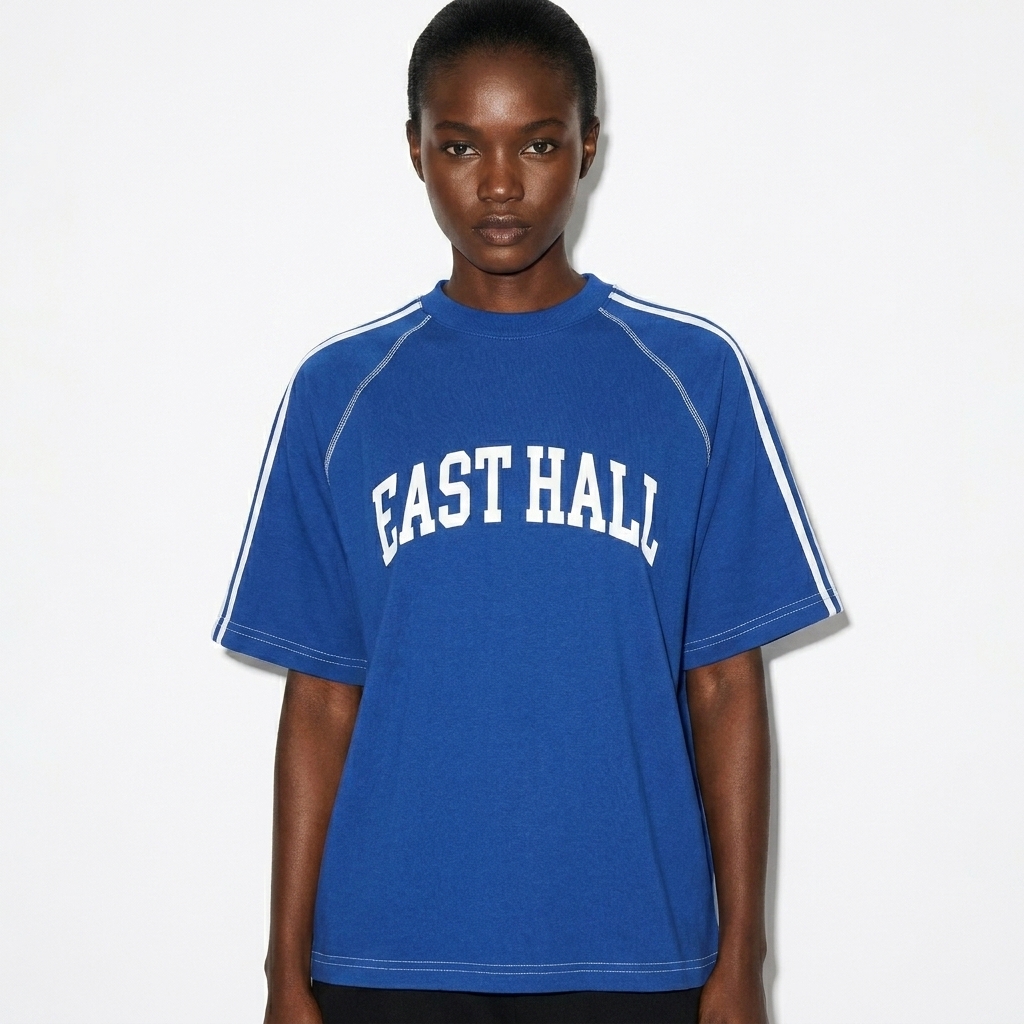 Custom Striped Contrast Stitch T-Shirt worn by a broad-shouldered West African female fashion influencer, y2k revival styling, studio lookbook — custom custom striped contrast stitch t-shirt