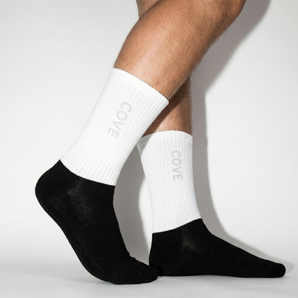 Custom Sublimated Crew Socks worn by a curvy British male fashion influencer, sporty athleisure styling, studio lookbook — custom custom sublimated crew socks