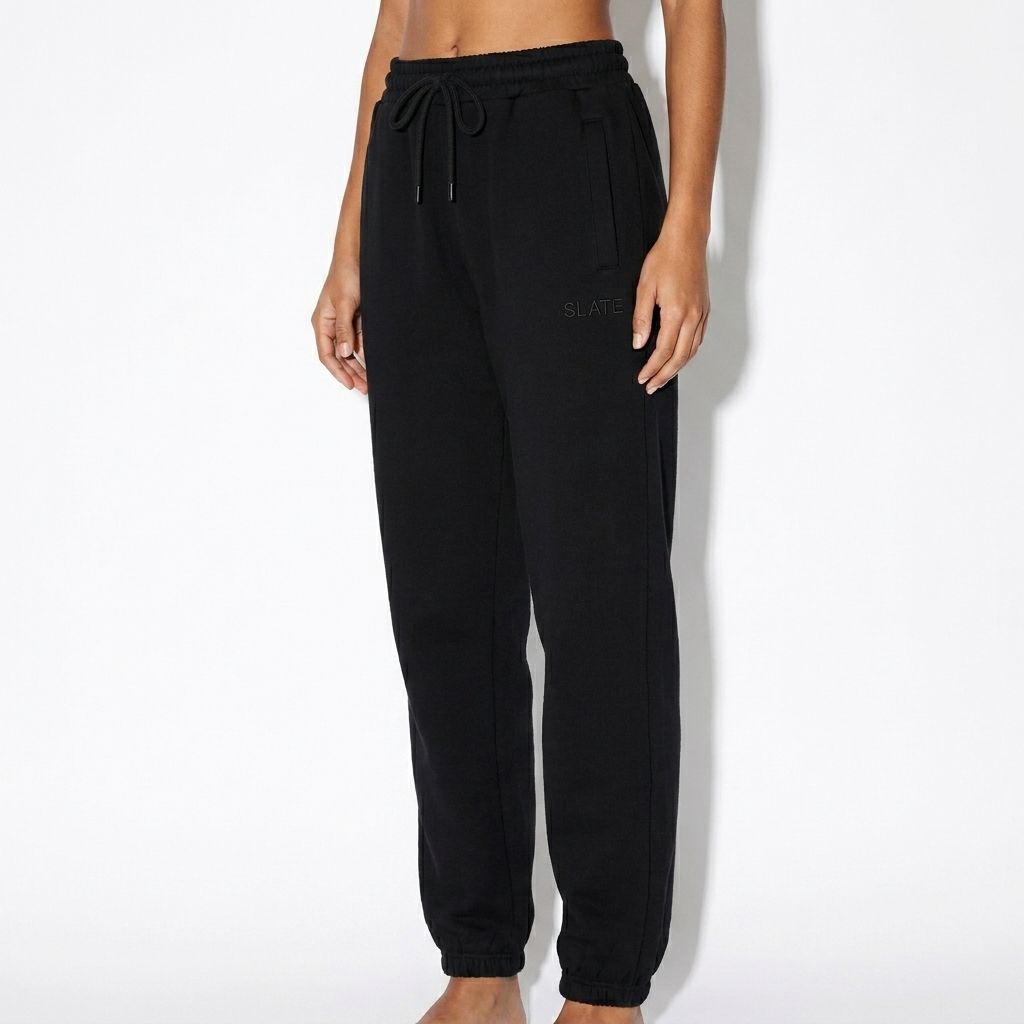 Custom Tapered Joggers worn by a petite Brazilian female fashion influencer, sporty athleisure styling, studio lookbook — custom custom tapered joggers