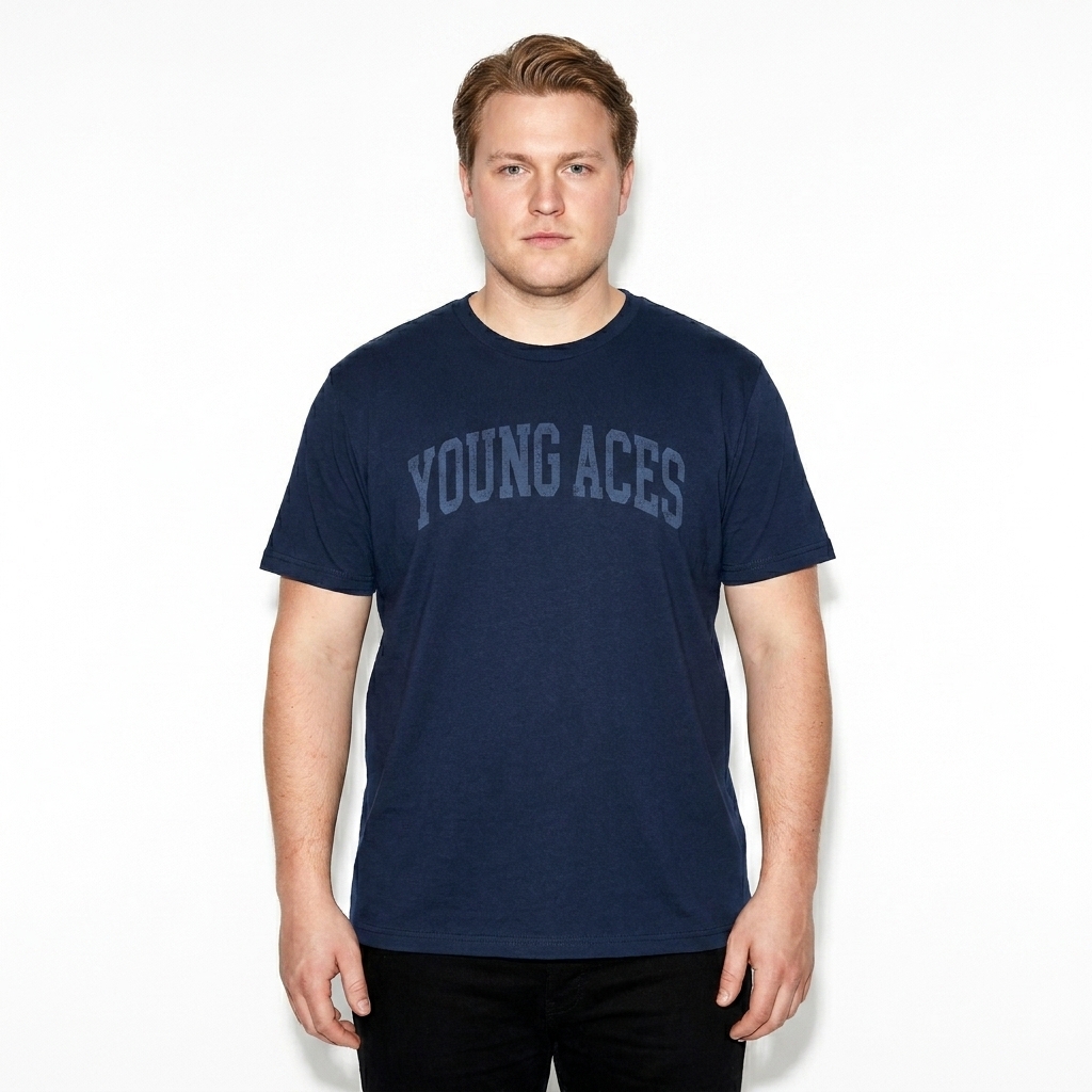 Toddler Jersey T-Shirt worn by a curvy Scandinavian male fashion influencer, workwear utility styling, studio lookbook — custom toddler jersey t-shirt