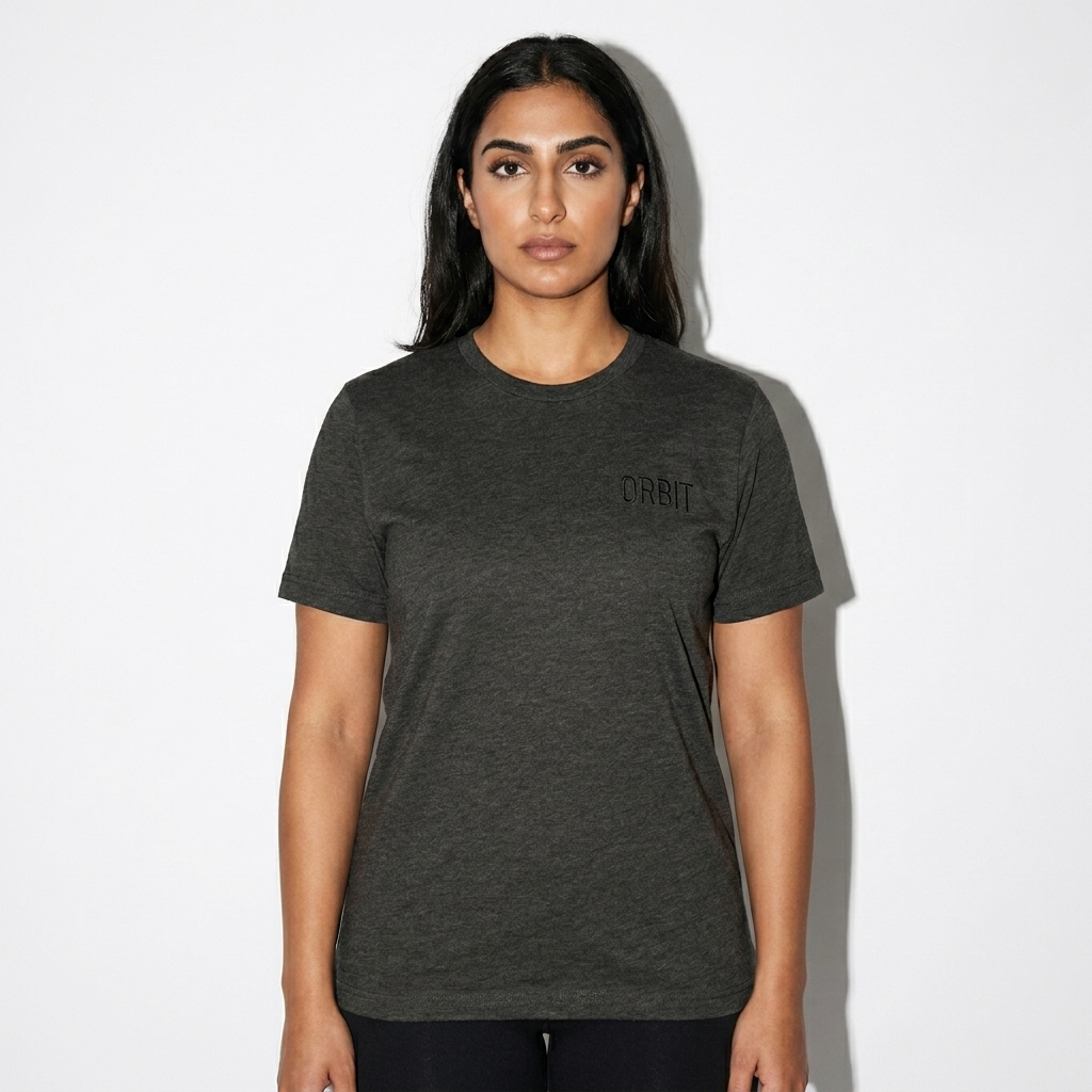Tri-Blend T-Shirt worn by a broad-shouldered Arab female fashion influencer, sporty athleisure styling, studio lookbook — custom tri-blend t-shirt