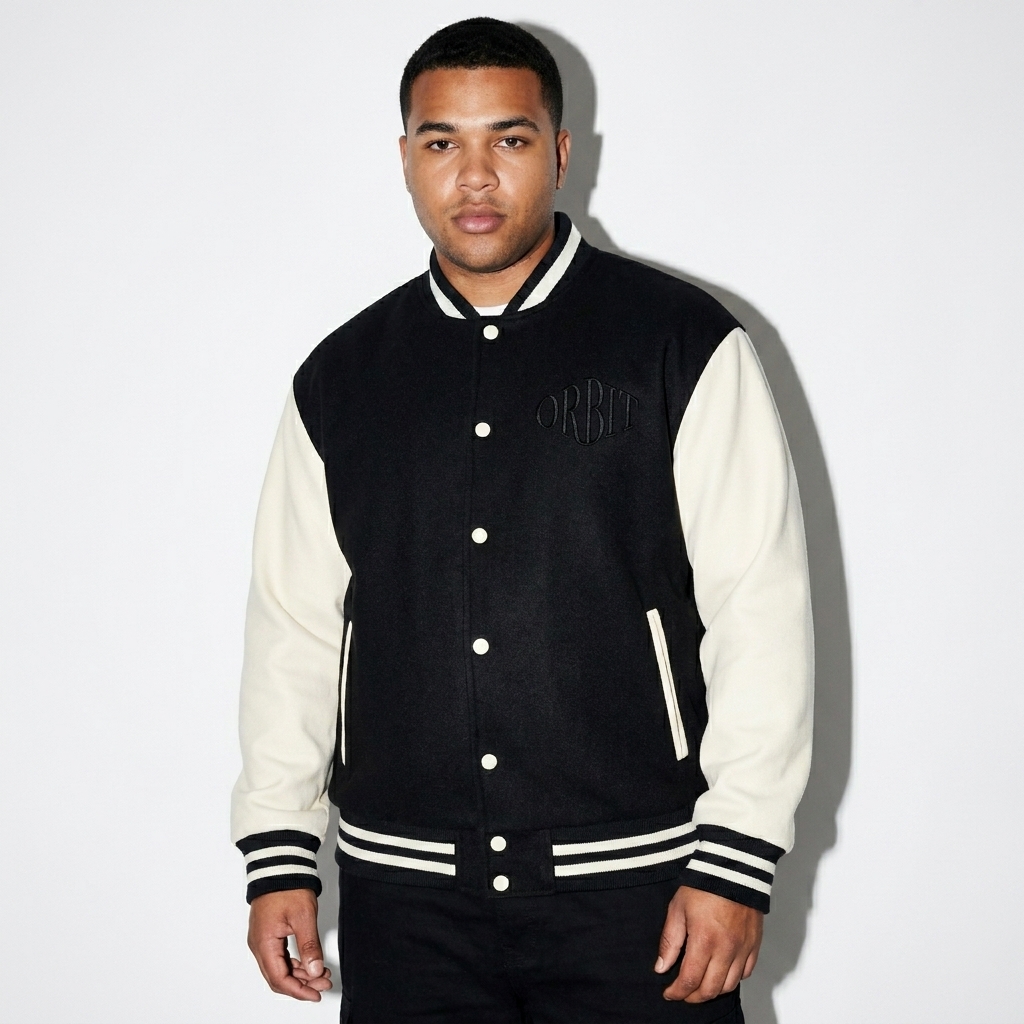 Two-Tone Varsity Jacket worn by a curvy British male fashion influencer, downtown streetwear styling, studio lookbook — custom two-tone varsity jacket