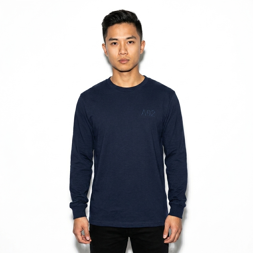 Unisex Long Sleeve Tee worn by a petite Vietnamese male fashion influencer, techwear modern styling, studio lookbook — custom unisex long sleeve tee