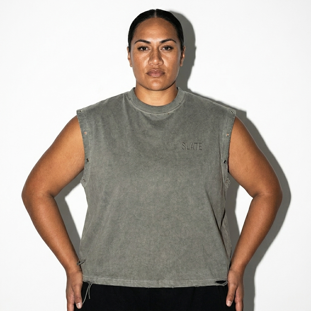 Distressed Grommet Tank Top worn by a broad-shouldered Māori female fashion influencer, gorpcore outdoor styling, studio lookbook — custom distressed grommet tank top