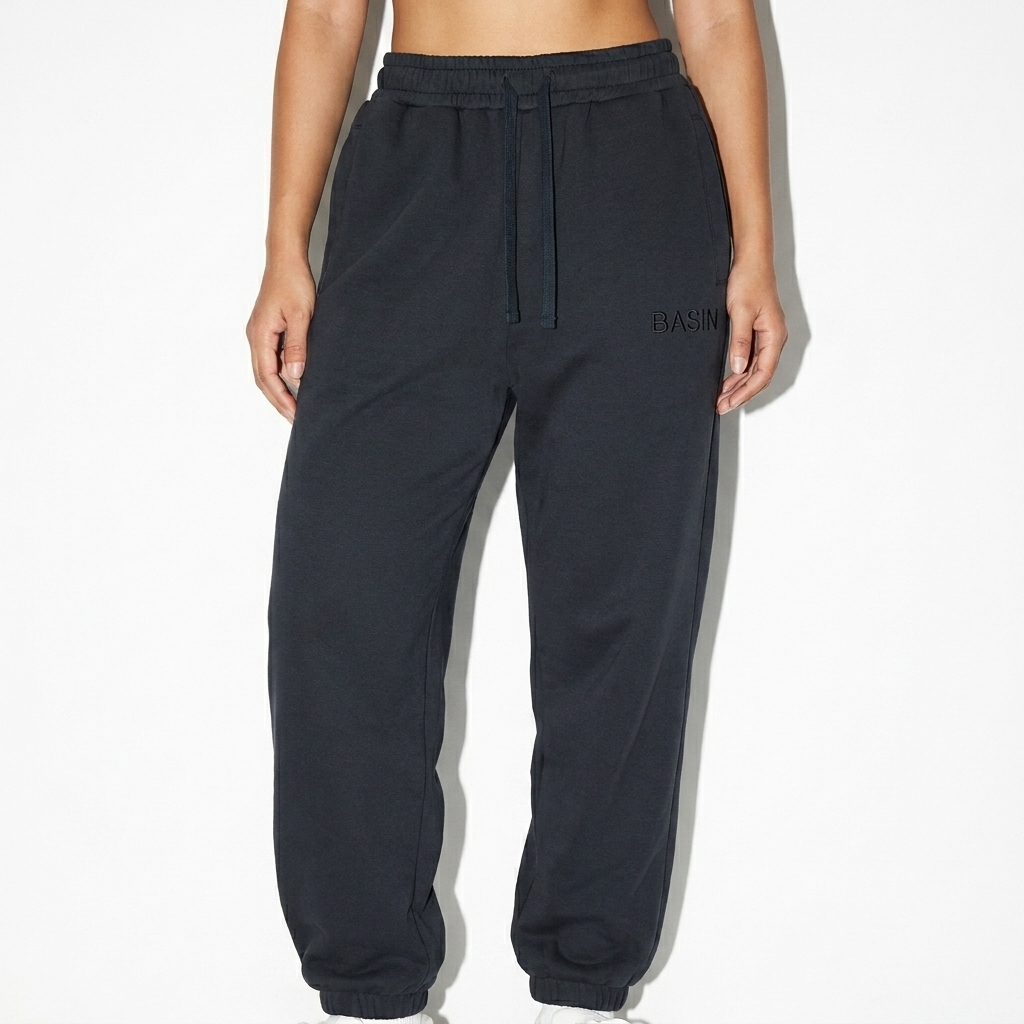 Drawstring Jogger Sweatpants worn by a broad-shouldered Vietnamese female fashion influencer, downtown streetwear styling, studio lookbook — custom drawstring jogger sweatpants