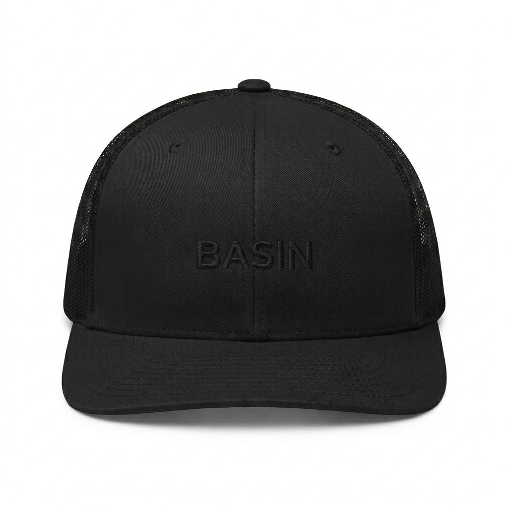 Custom Embroidered Snapback Trucker Cap design direction 1: Tonal Minimalist Wordmark featuring the BASIN wordmark