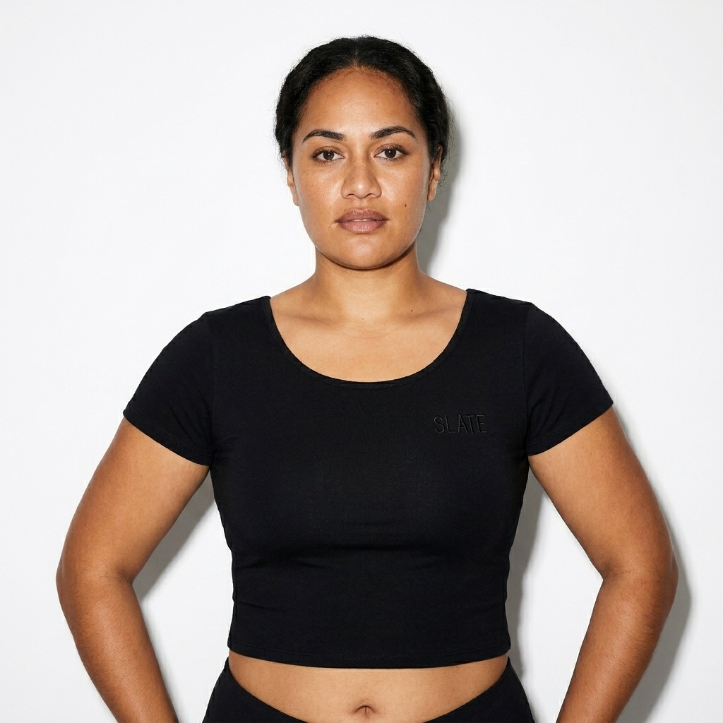 Essential Cotton Bodycon Crop Top worn by a mid-size Māori female fashion influencer, sporty athleisure styling, studio lookbook — custom essential cotton bodycon crop top