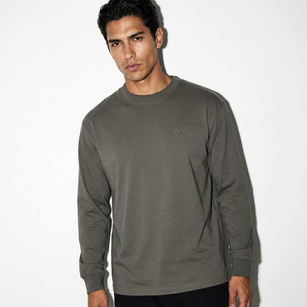 Essential Crewneck Long-Sleeve T-Shirt worn by a lean Latino male fashion influencer, downtown streetwear styling, studio lookbook — custom essential crewneck long-sleeve t-shirt