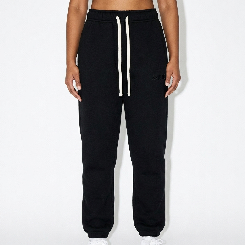 Essential Fleece Sweatpants worn by a broad-shouldered South Asian female fashion influencer, gorpcore outdoor styling, studio lookbook — custom essential fleece sweatpants
