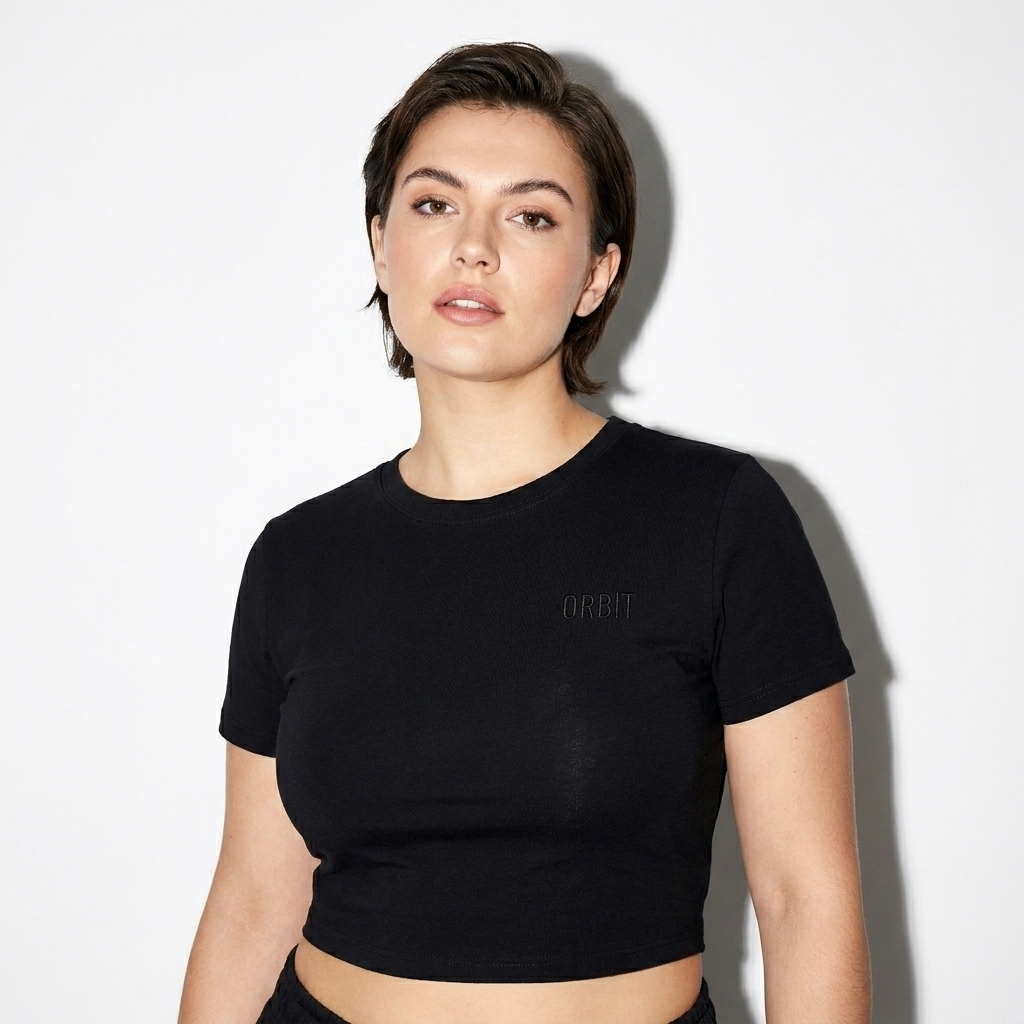 Fitted Crop Cotton T-Shirt worn by a mid-size British female fashion influencer, downtown streetwear styling, studio lookbook — custom fitted crop cotton t-shirt
