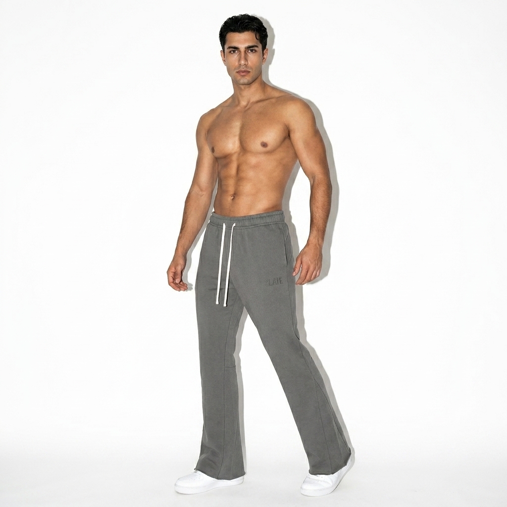 Flared Sweatpants worn by a toned Turkish male fashion influencer, preppy ivy styling, studio lookbook — custom flared sweatpants