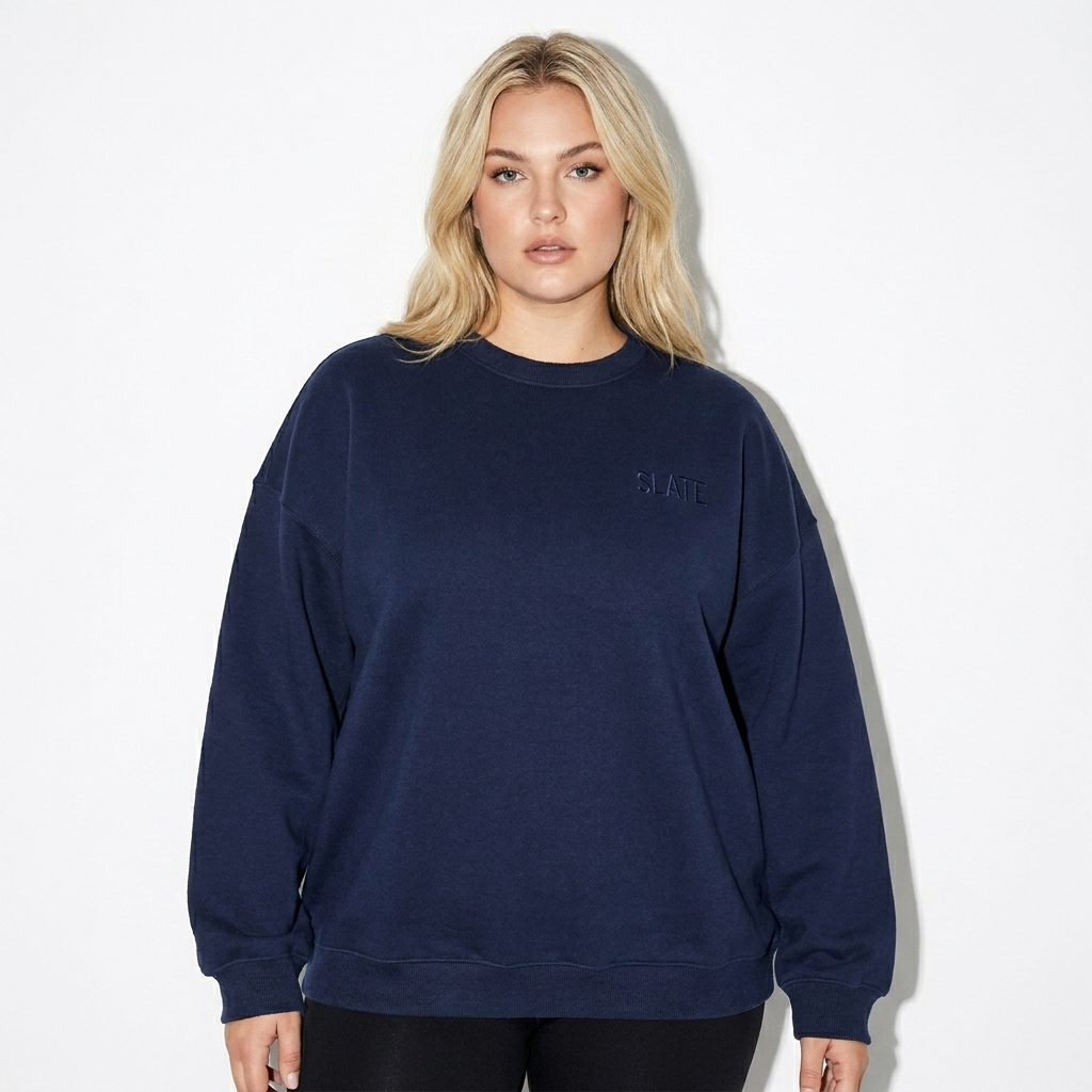 Fleeced Crewneck Sweatshirt worn by a curvy White American female fashion influencer, workwear utility styling, studio lookbook — custom fleeced crewneck sweatshirt