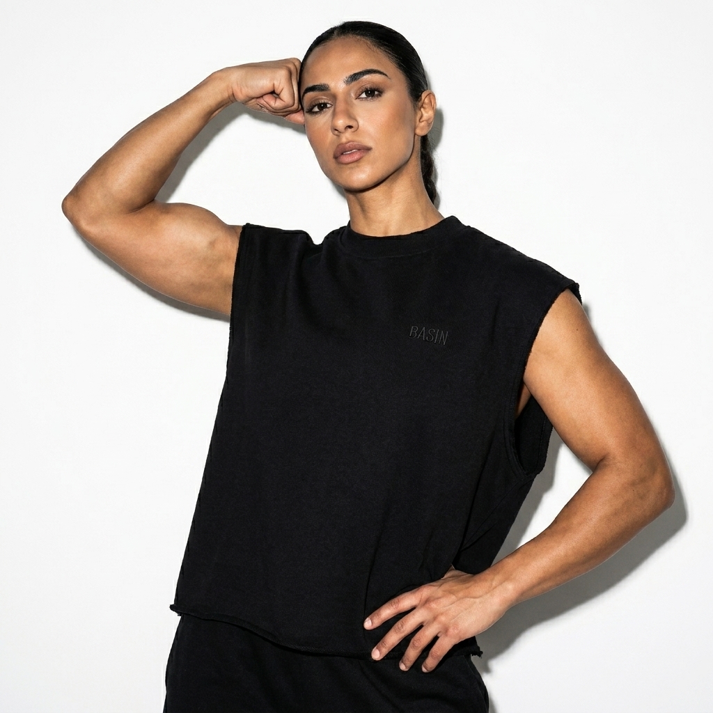 French Terry Boxy Tank Top worn by a athletic muscular Arab female fashion influencer, techwear modern styling, studio lookbook — custom french terry boxy tank top